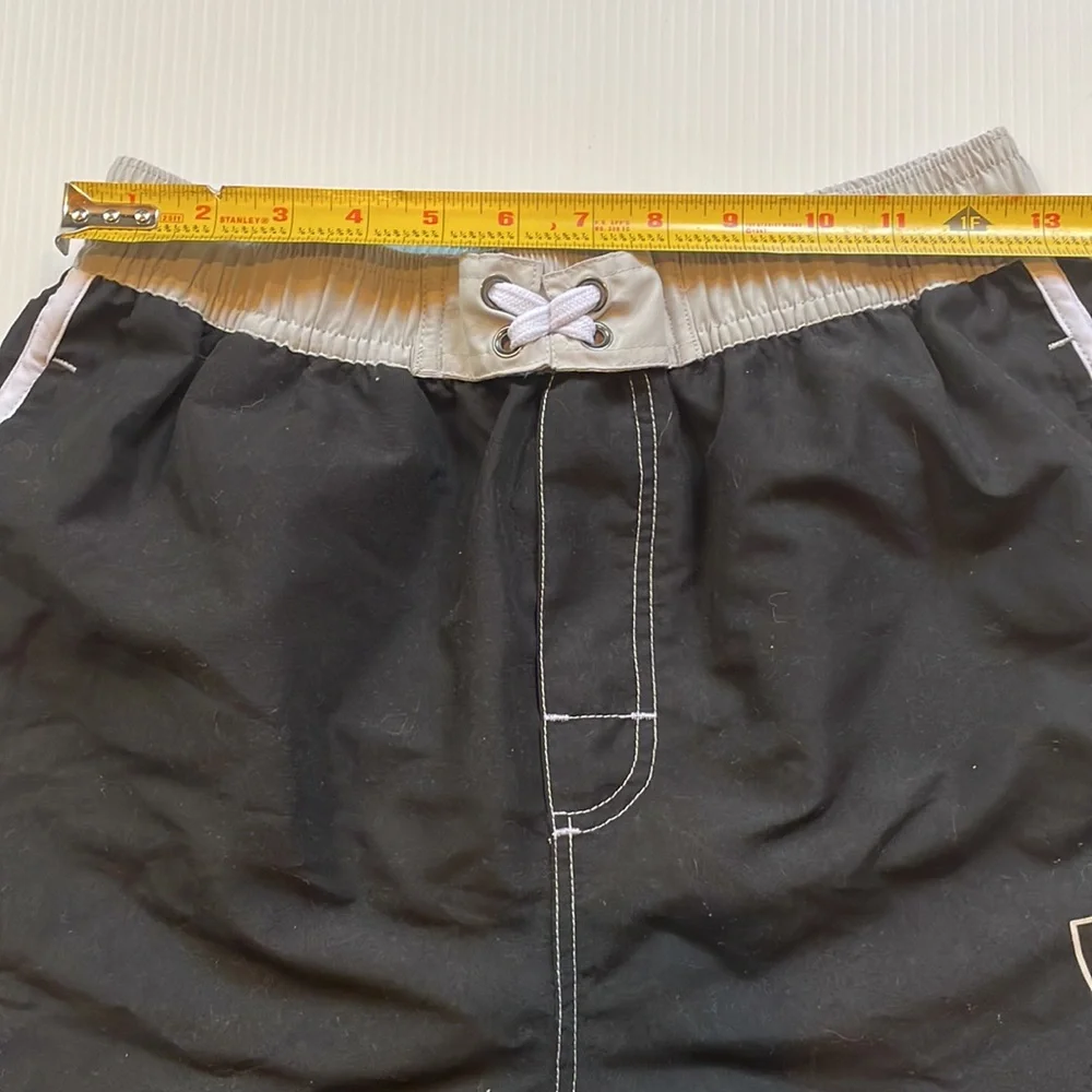 NFL Oakland Raiders black & white board short, swim trunk.  Boys large 14-16